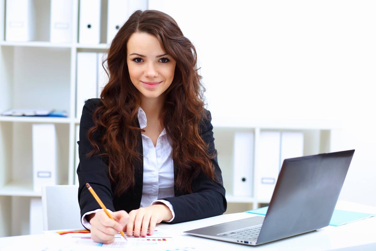 Woman in an office woring on laptop